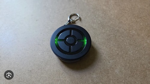 DuoMon 3 Pro auto catcher with green LED active on a desk