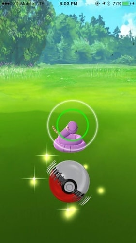 Pokémon GO Curveball with a spinning Poké Ball and colored catch circle