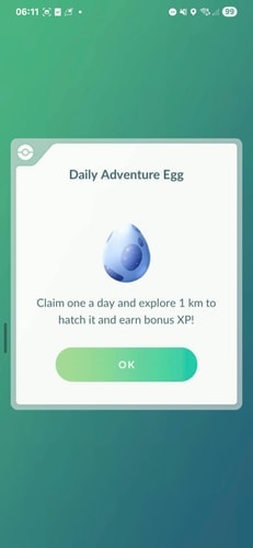 Pokémon GO Daily Adventure Egg claim interface showing the egg dialog with 10,000 XP reward description