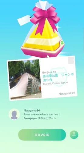 Pokémon GO gift with postcard before opening