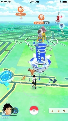 Pokémon GO raid battle scene with multiple Trainers